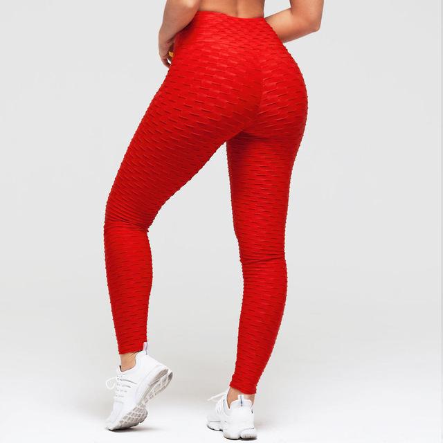 Kvinna i texturerade scrunch tights med hög midja