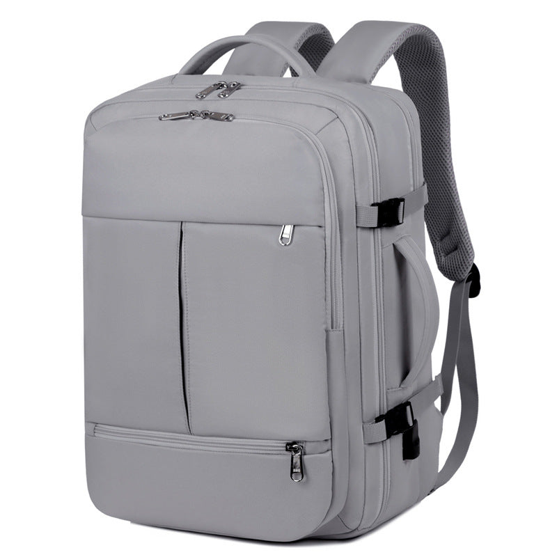 Grå ryggsäck med laptopfack och många fickor